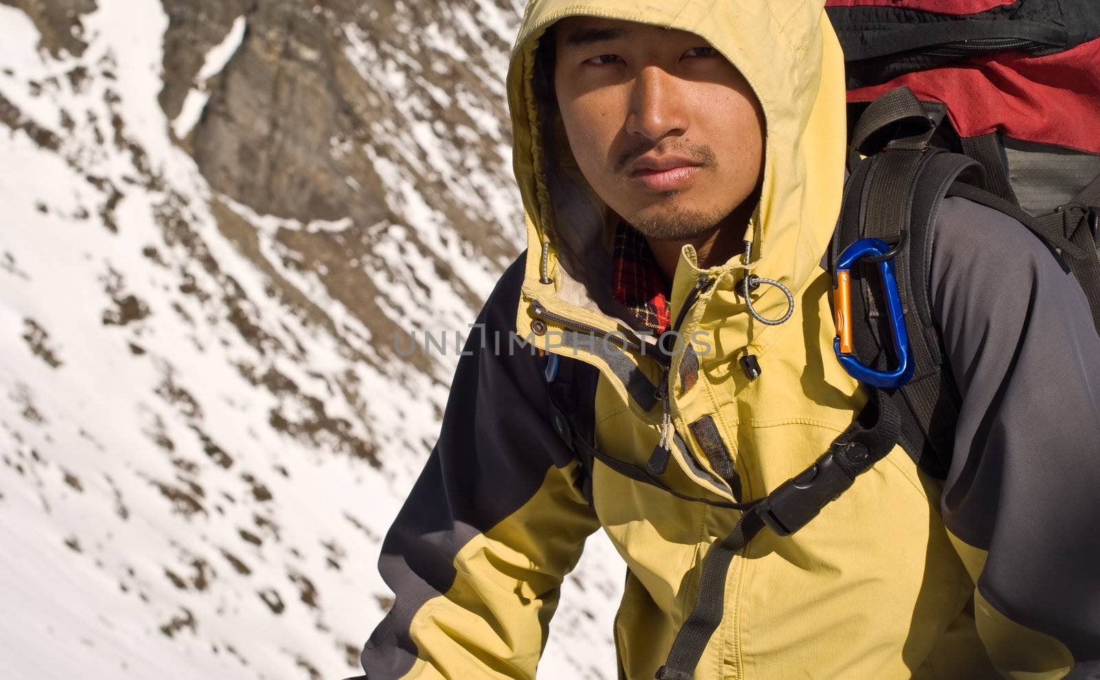 Portrait of Asian mountaineer man with tired face.
