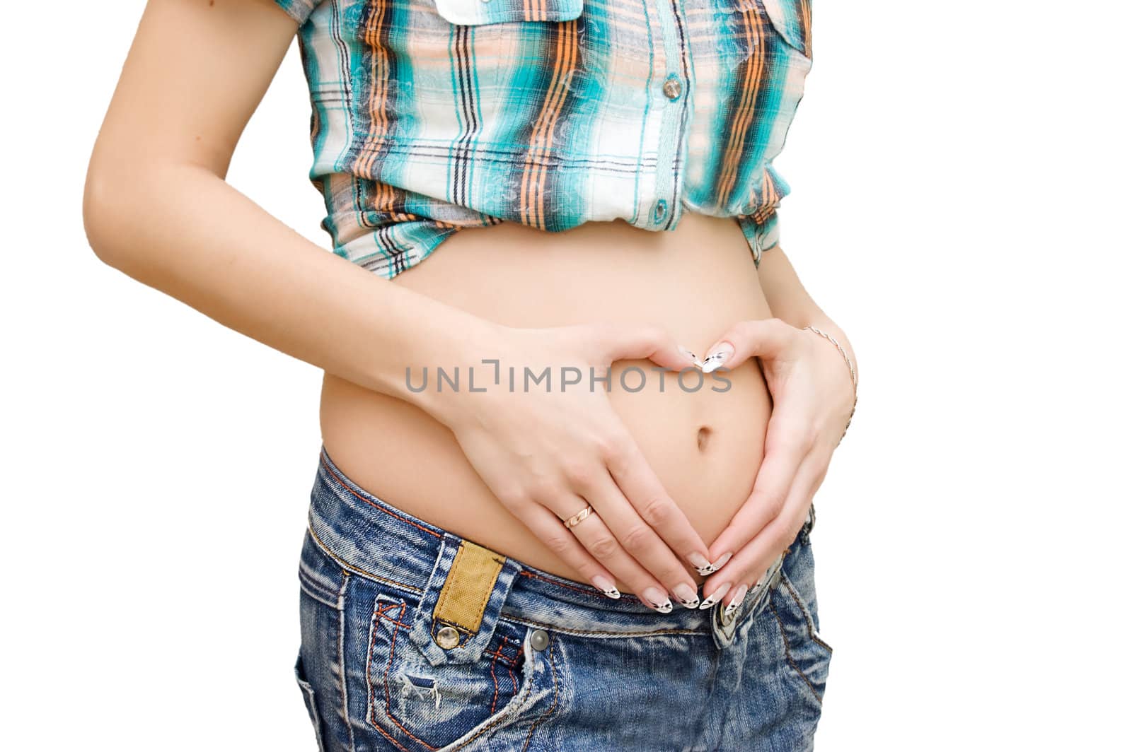 Woman fingers forming heart shape on pregnant belly isolated on white
