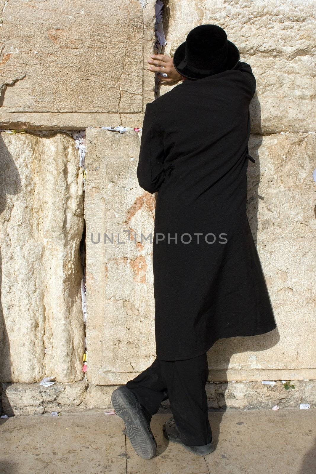 A religious orthodox Jew prays at the Wailing Wall. Jerusalem, Israel.      
