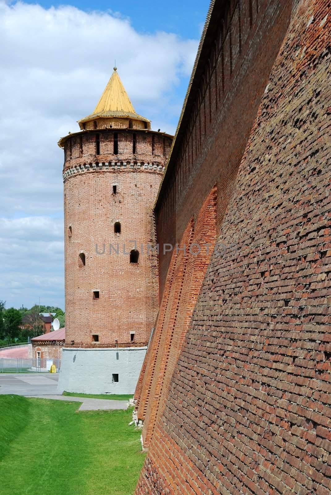 Partly reconstructed brick wall and tower of old fortress in Kolomna town near Moscow, Russia (vertical version)