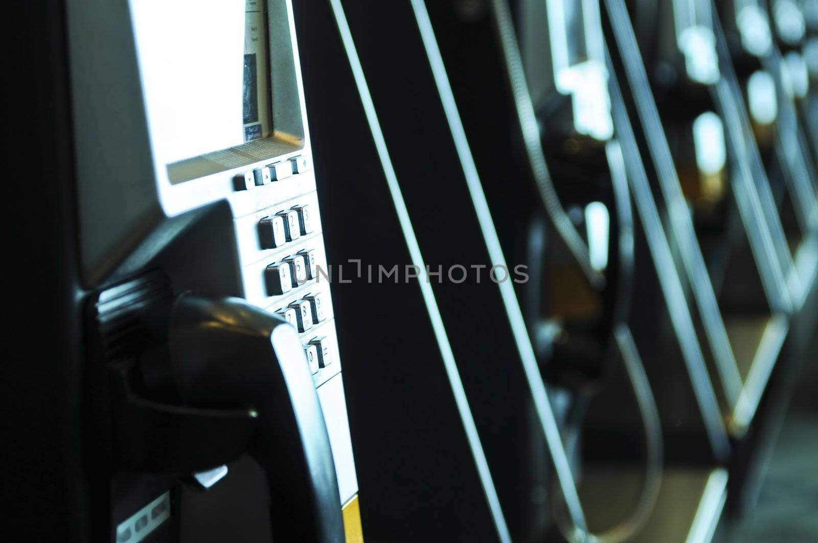 Row of pay phones in airport close up