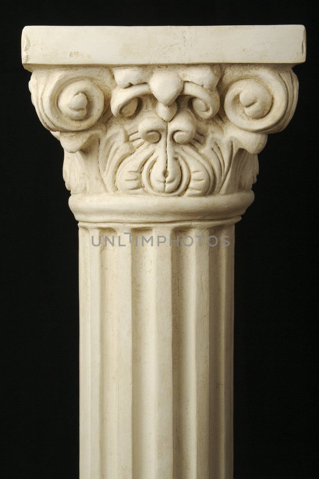 Ancient Replica Column Pillar on a Black Background.