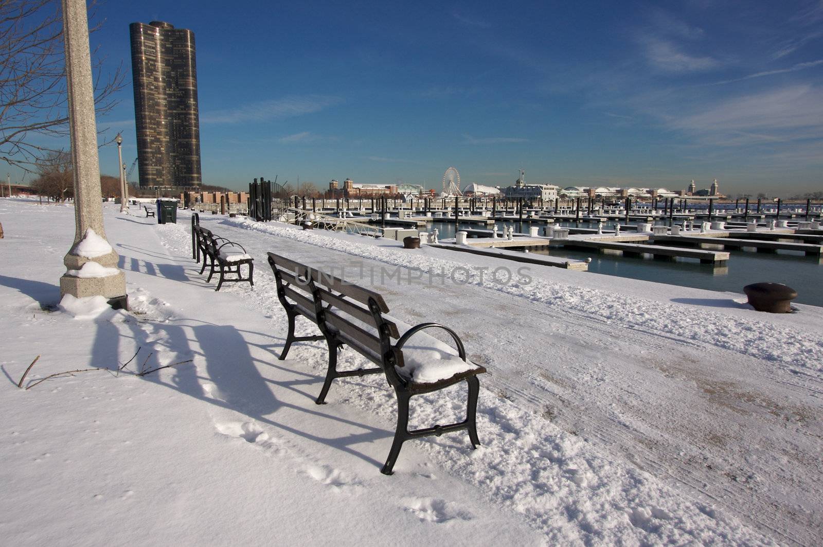 Empty Snowy Bench in Chicago After Winter Snow Along Lake Shore Drive.