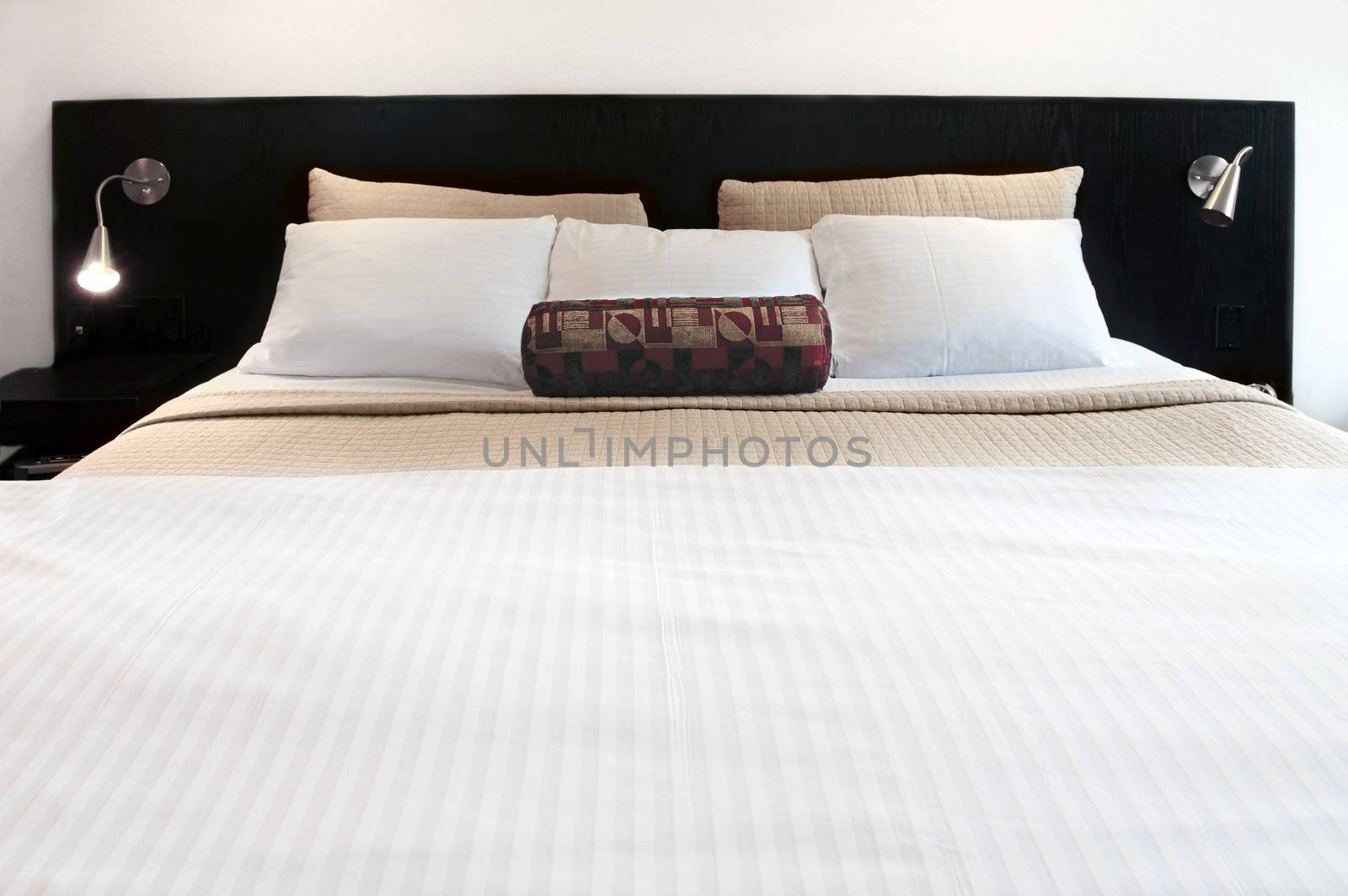 Comfortable bed in upscale hotel close up