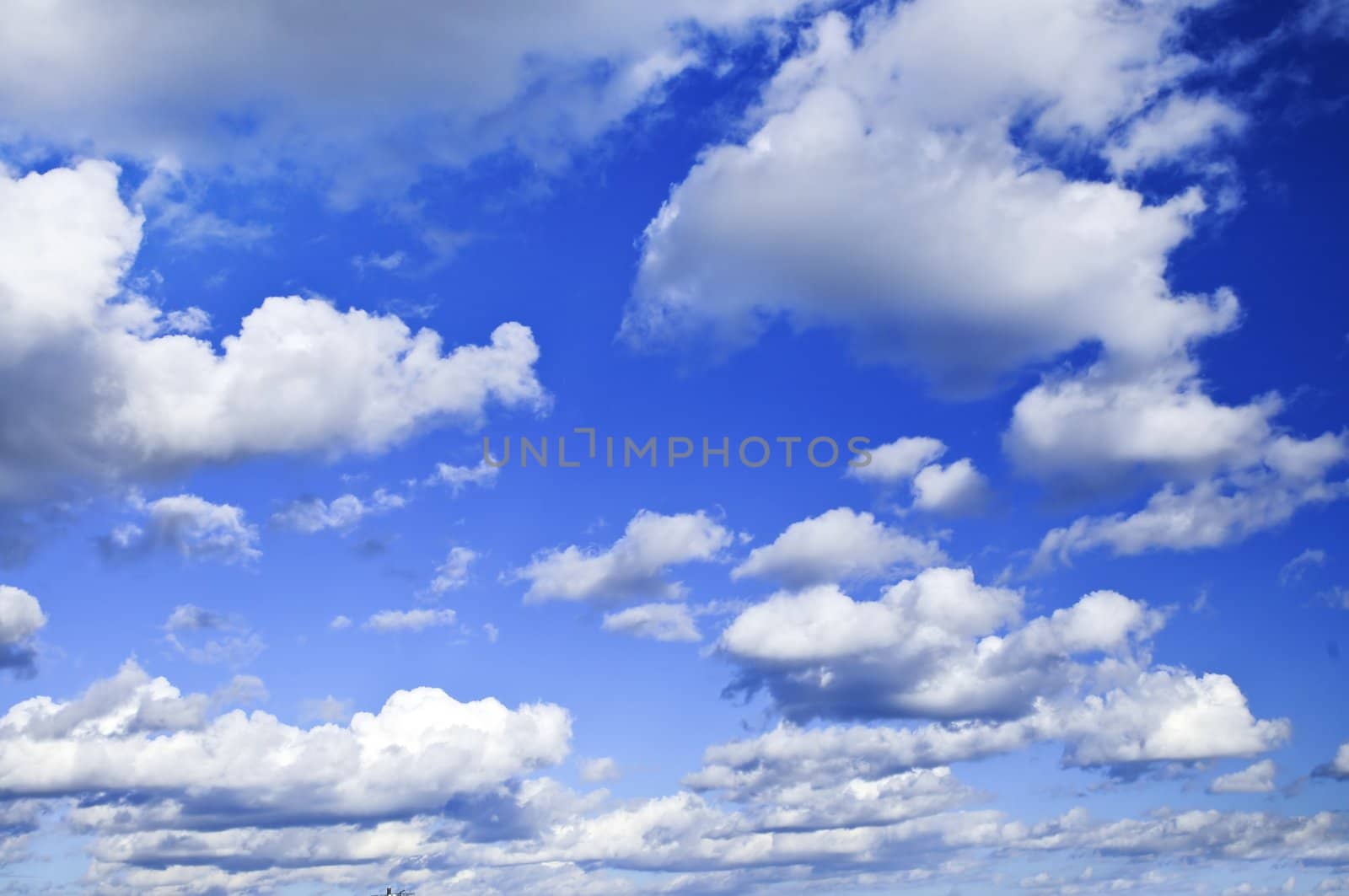 Background of blue sky with white clouds