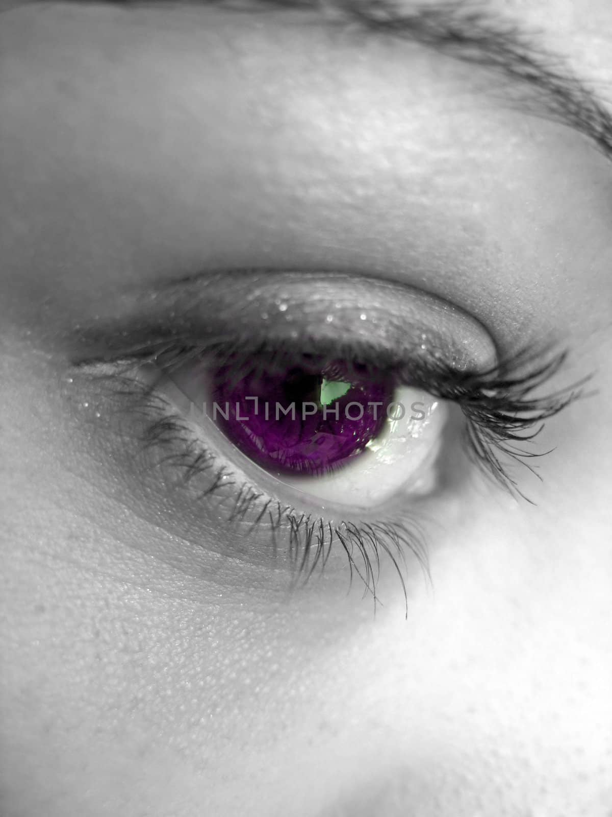 A macro shot of a pretty woman's eye with selective color.