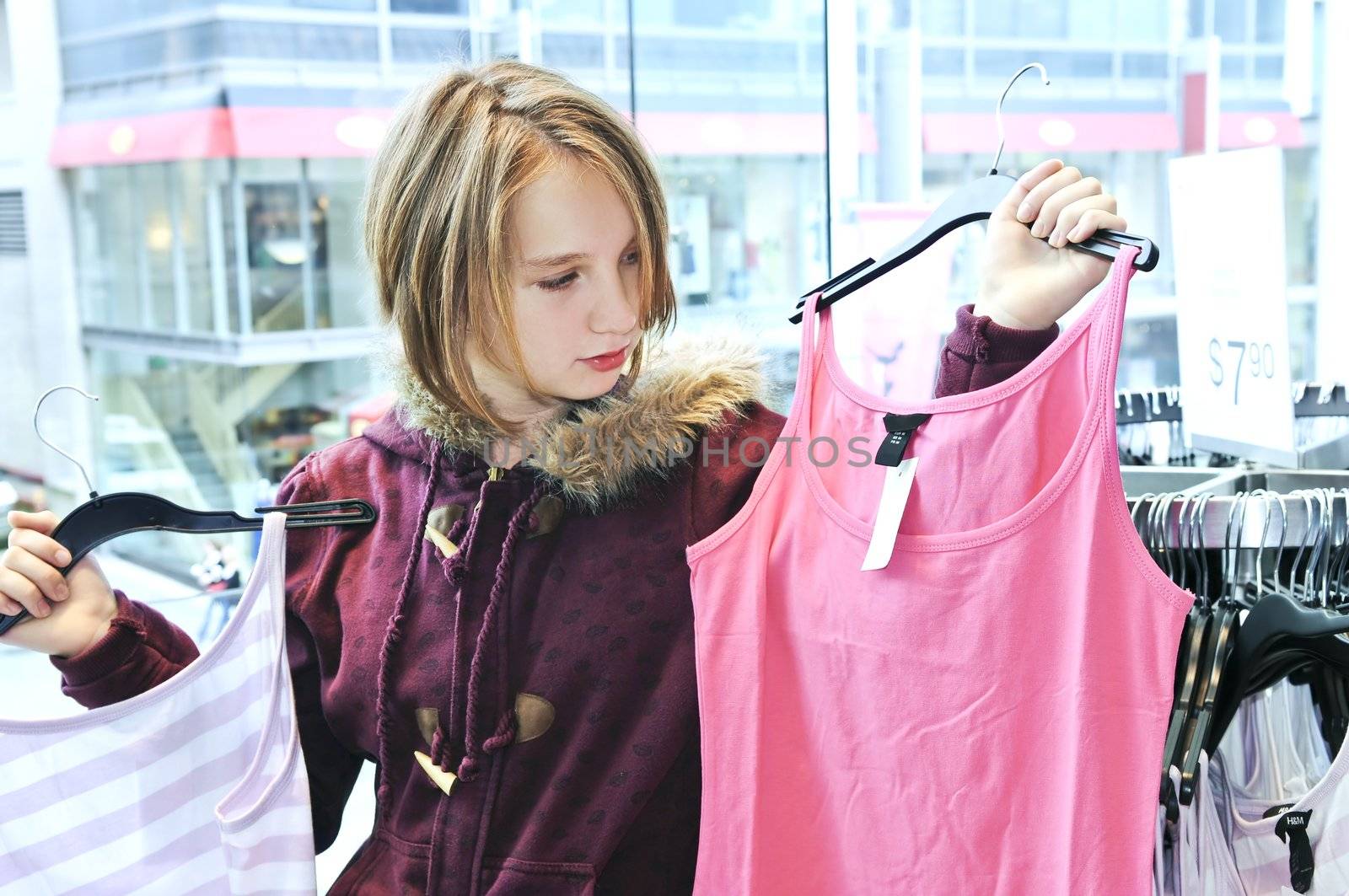 Teenage girl shopping for clothes and accessories