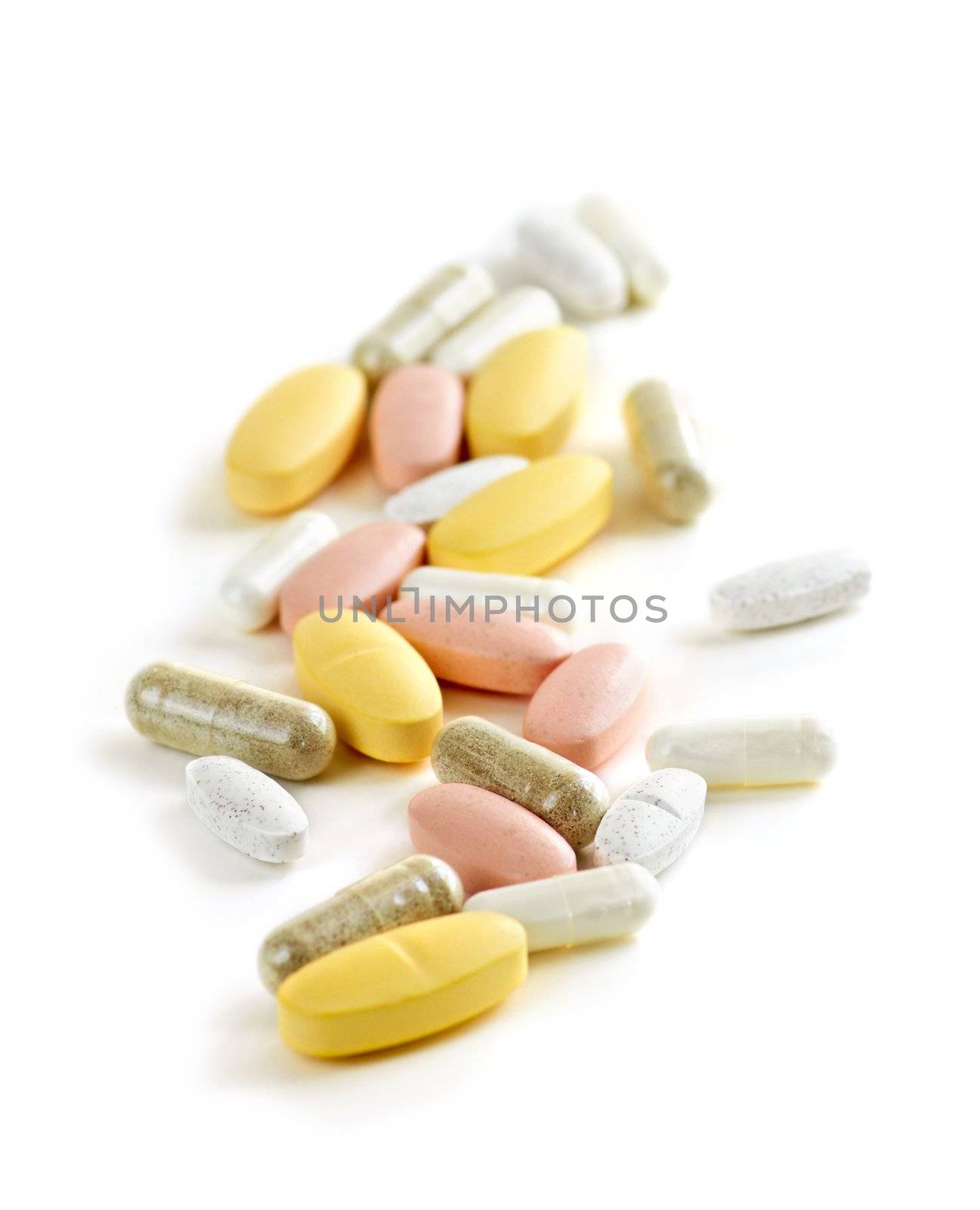 Mix of vitamins and herbal supplements on white background