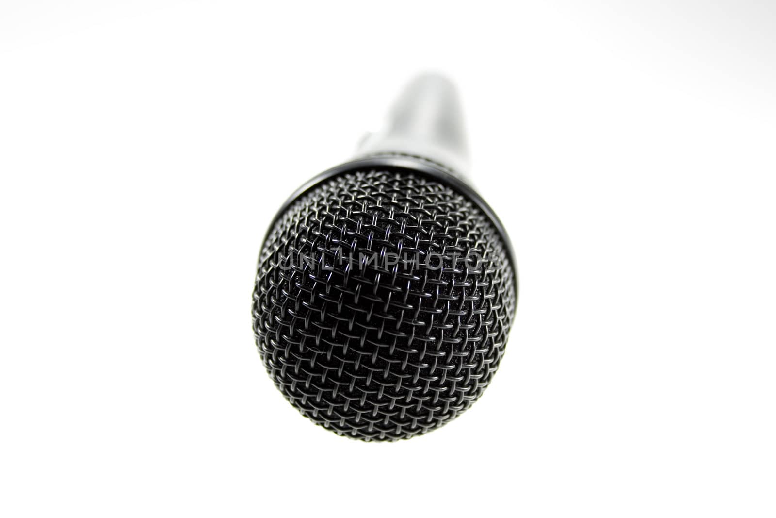 Black microphone on white background