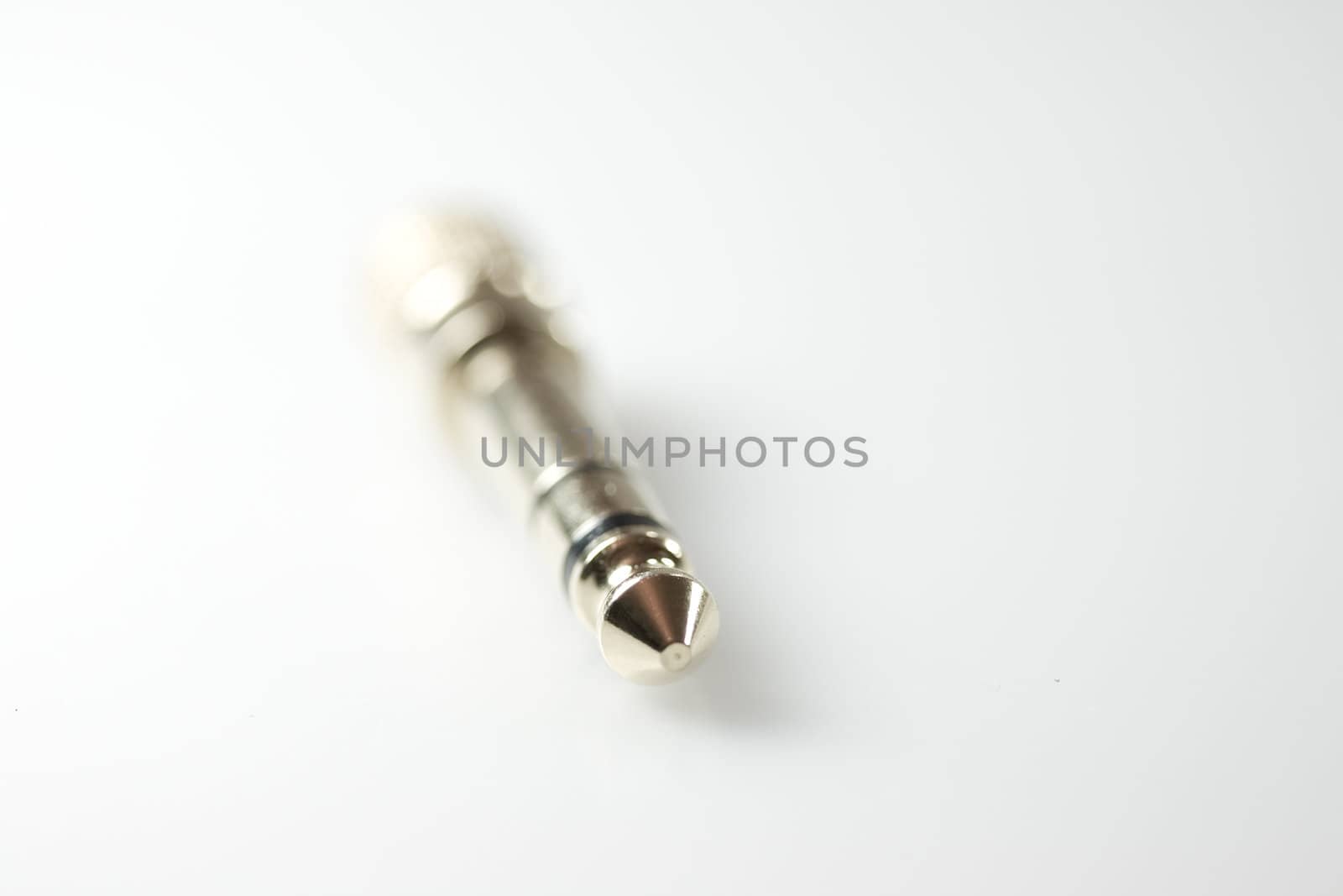 Metallic adapter on gray background