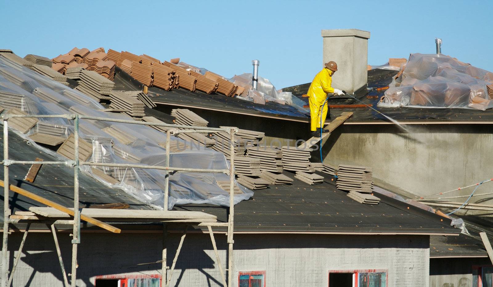 Construction Worker Pressure Washes  by Feverpitched