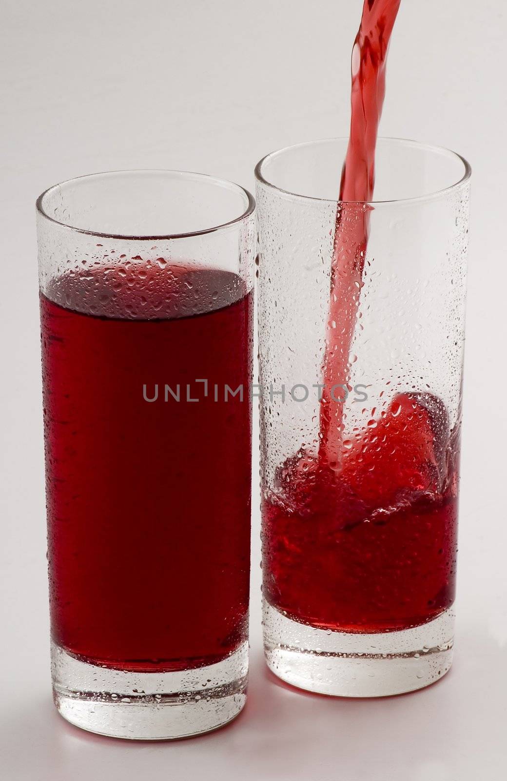 Glass glasses with a red drink