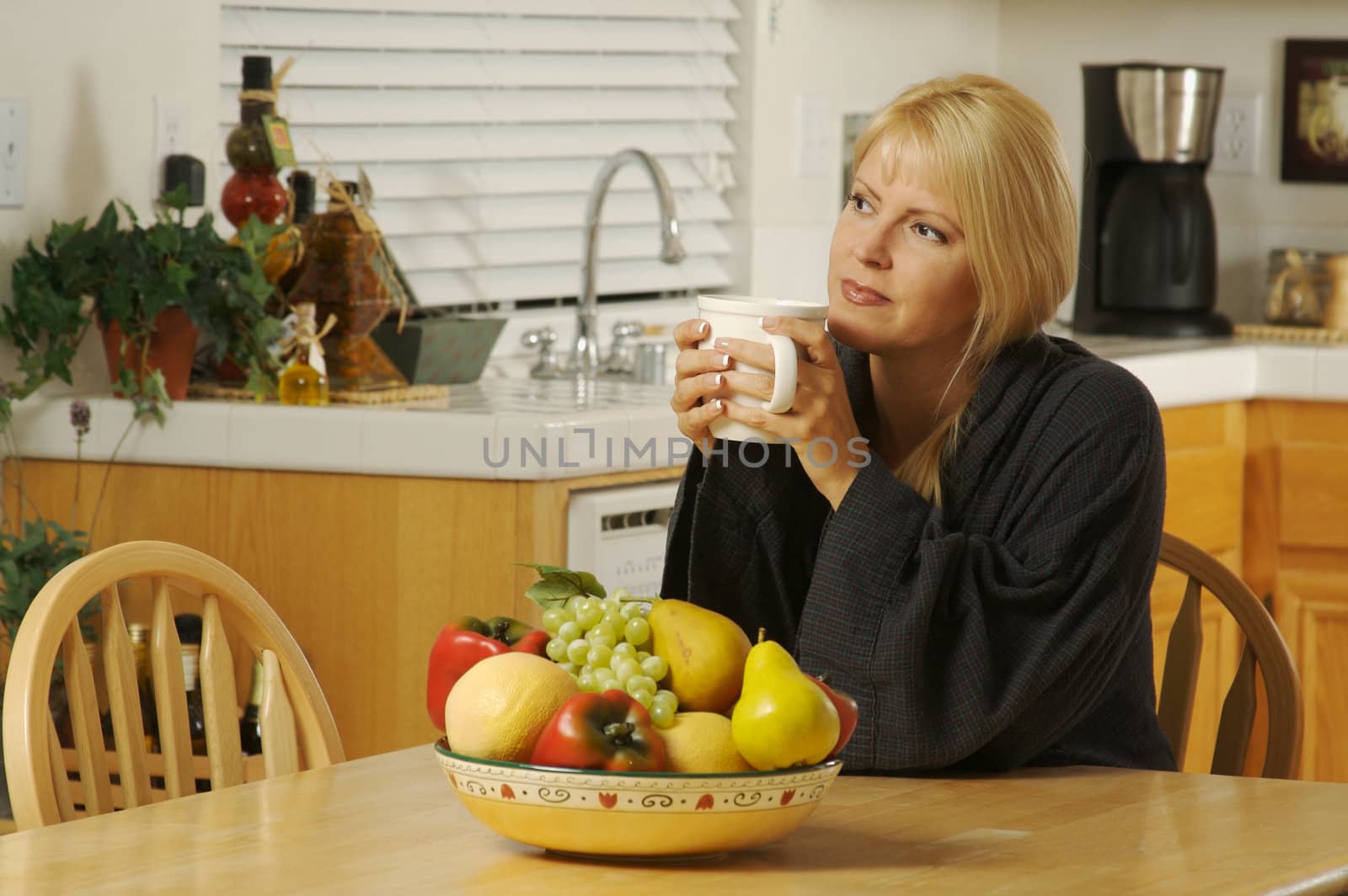 Woman in Kitchen with Cup of Coffee by Feverpitched