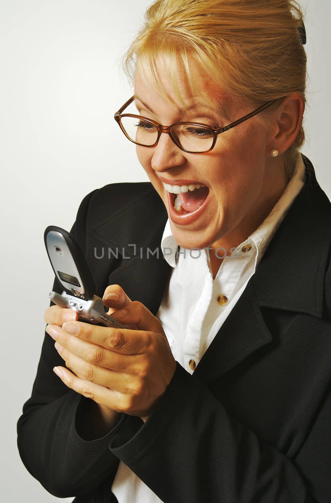 Elated Businesswoman Using Cell Phone