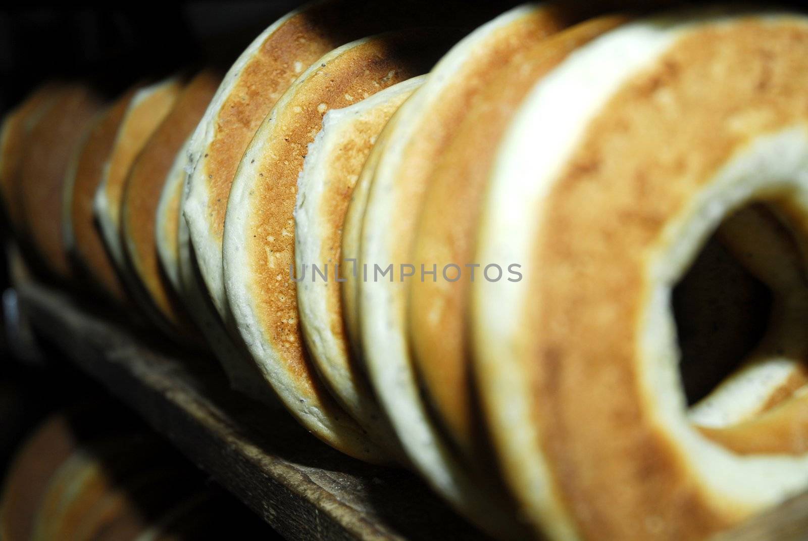 Many bagels on shelf in bakehouse 2