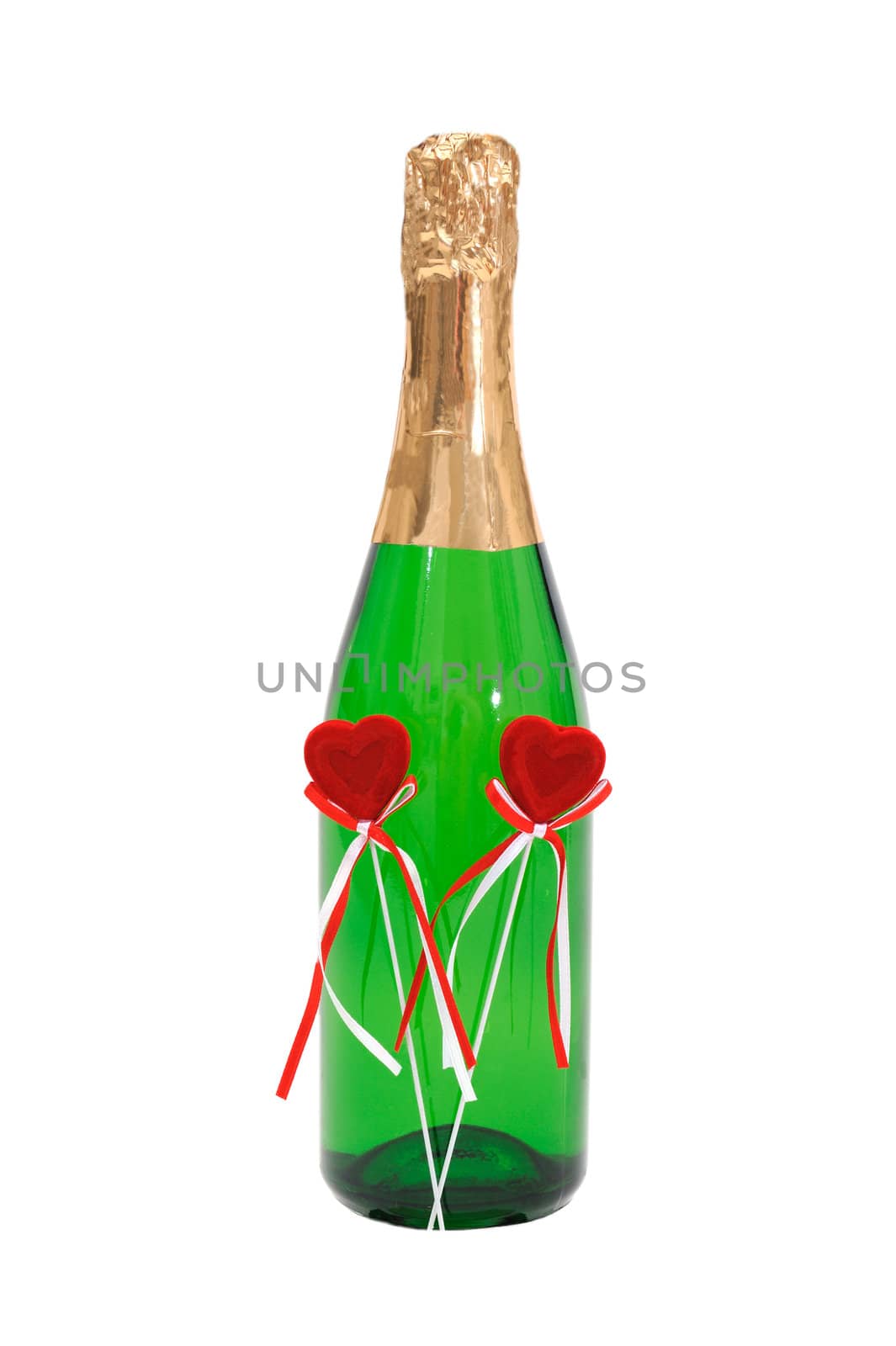 Bottle effervescent wine which decoration two plush red hearts. Isolated on white background.