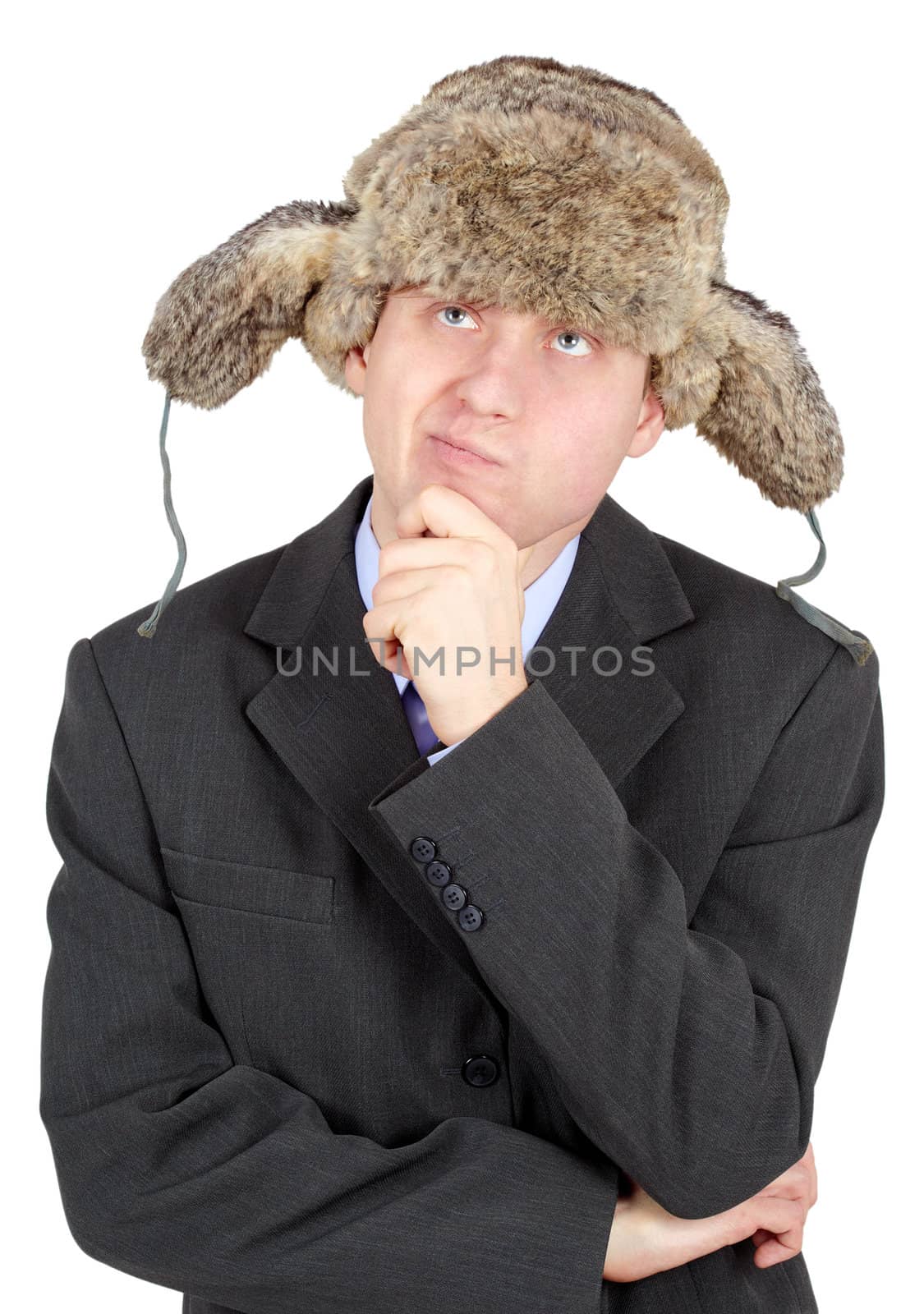 A young man in a fur hat dreams on a white background