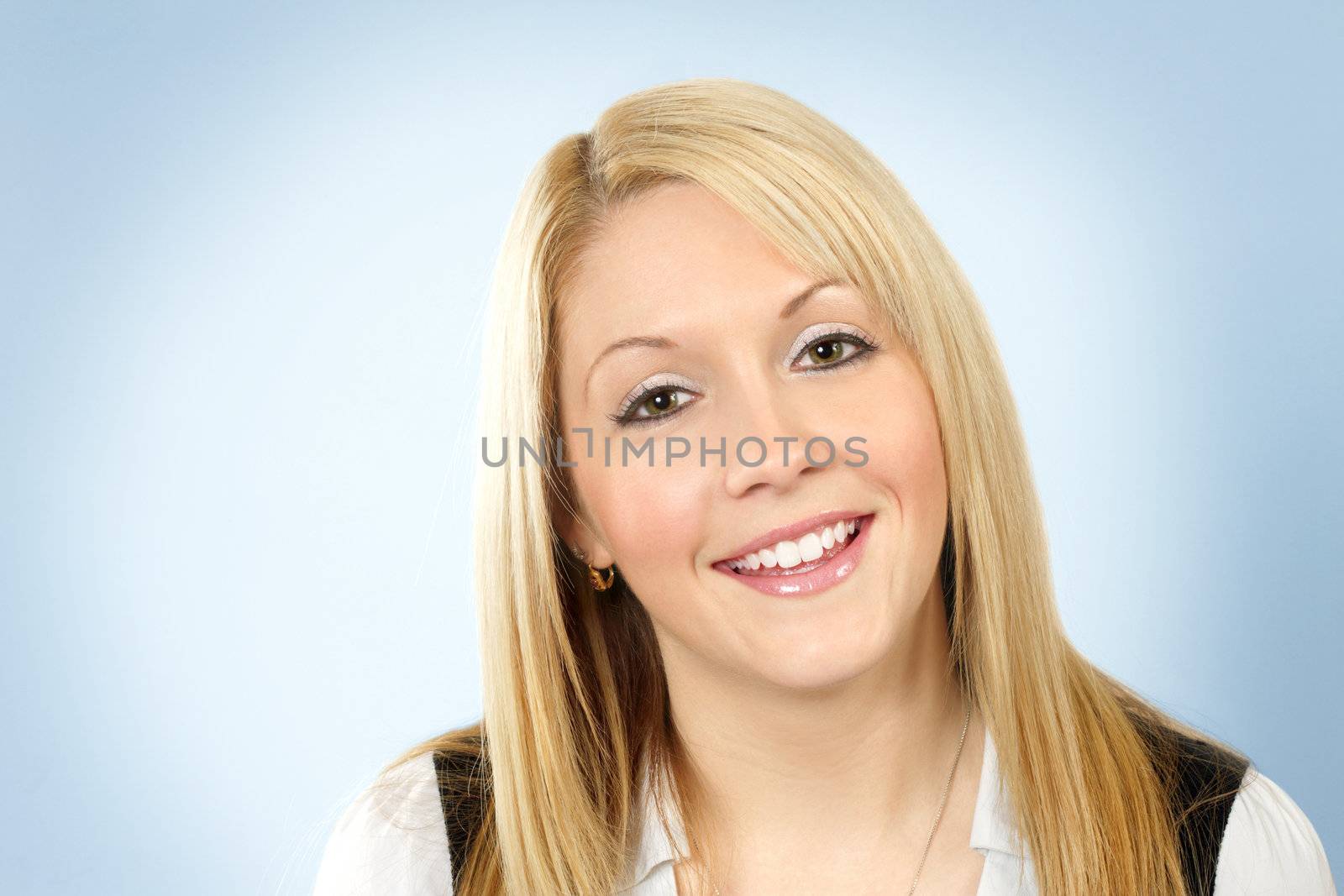 An cute friendly blonde girl smiling for the camera.
