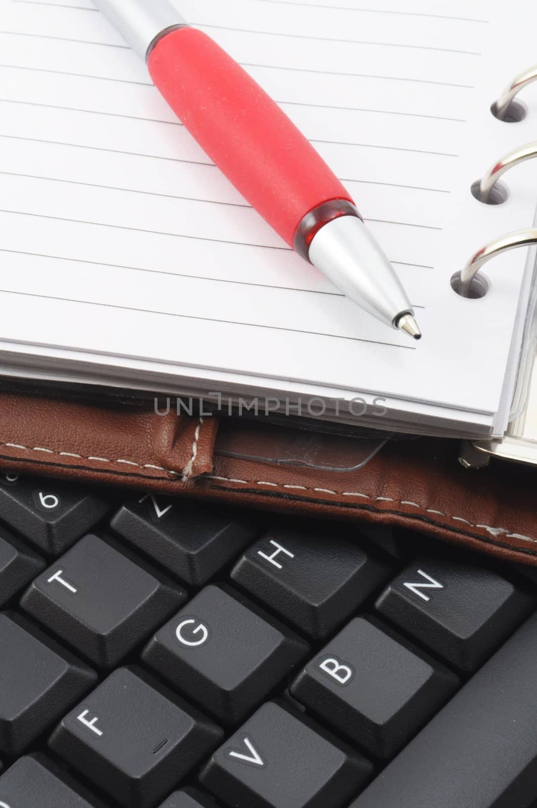 computer keyboard and organizer with pan in business office