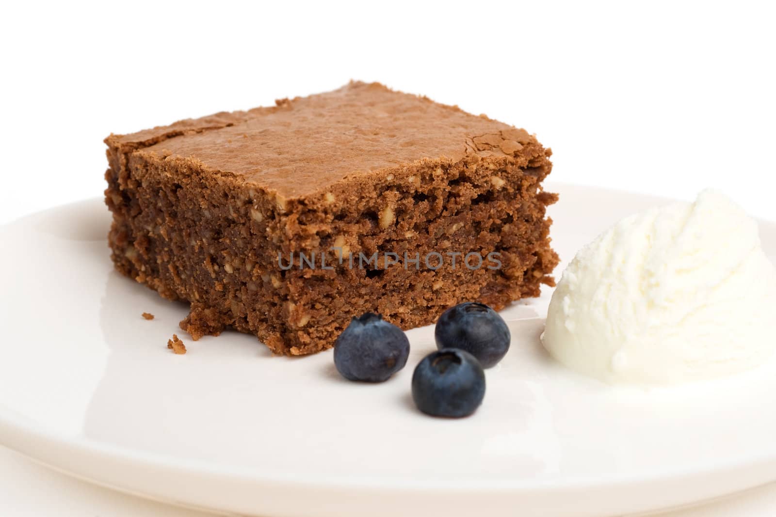 chocolate brownie with ice cream, isolated, shallow DOF