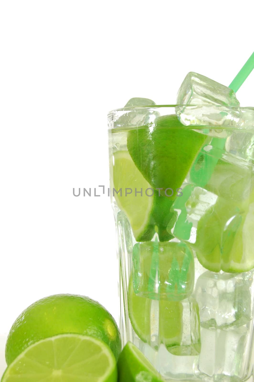 green cocktail with ice cubes and copyspace