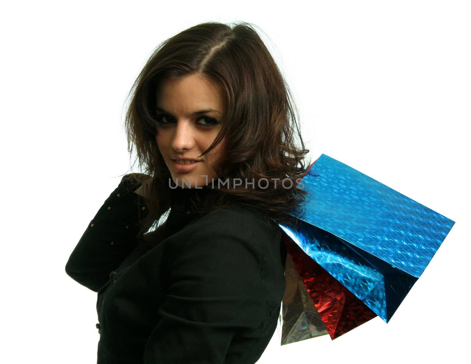 The happy girl with purchases, on a white background 