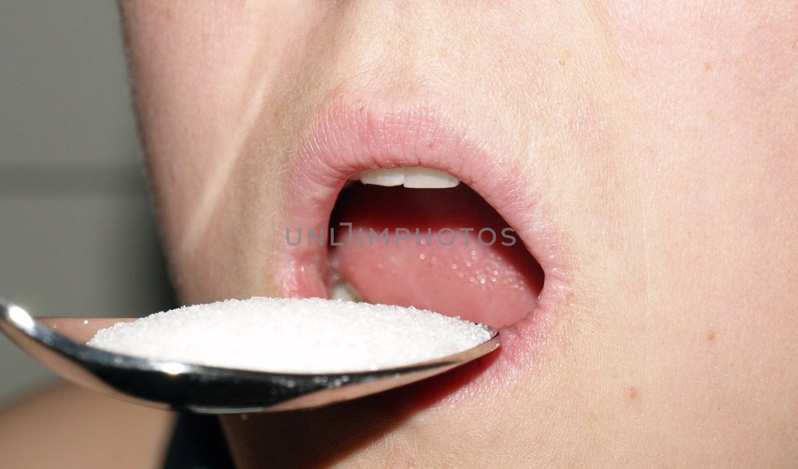 eating sugar with spoon