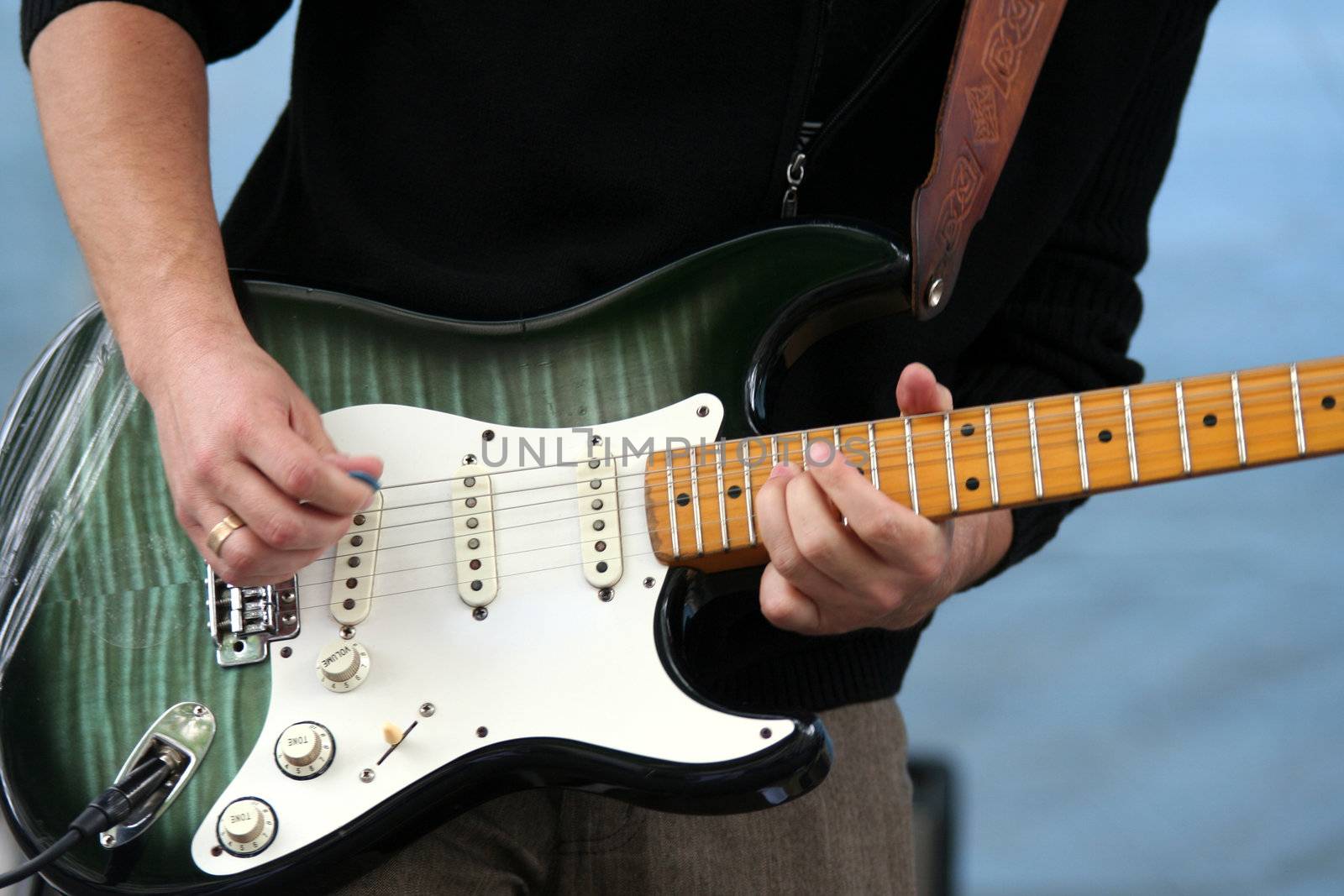 Electrical guitarist playing music