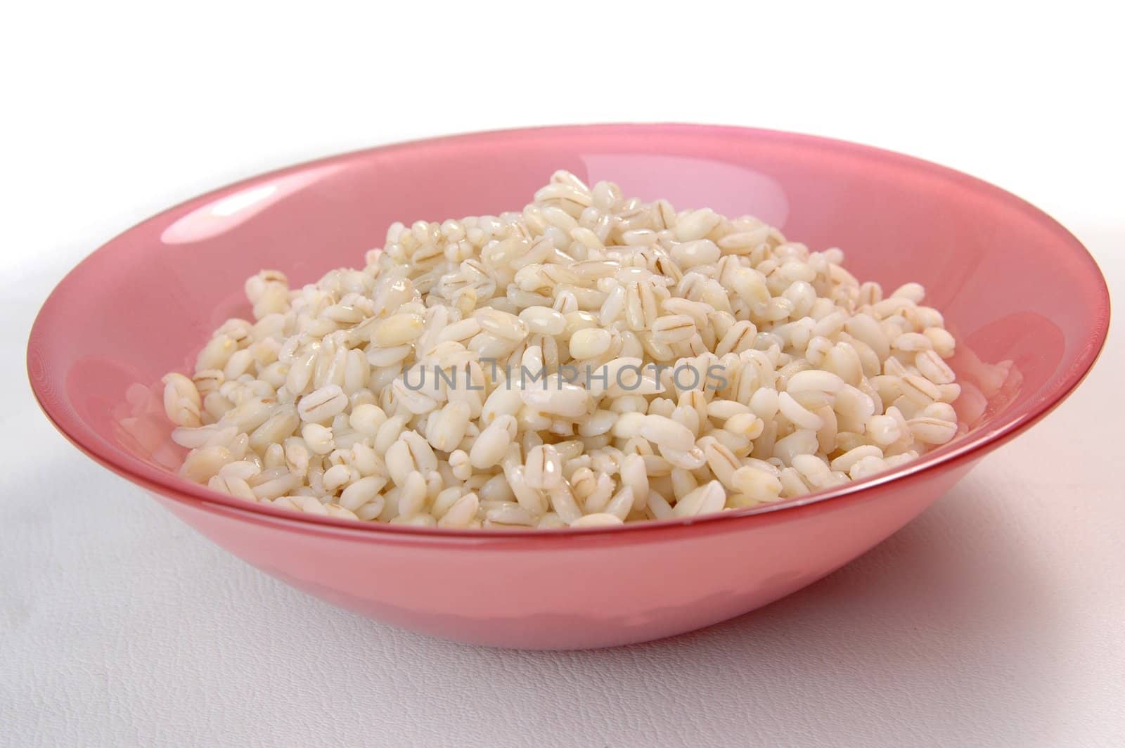 groats porridge in  plate on white