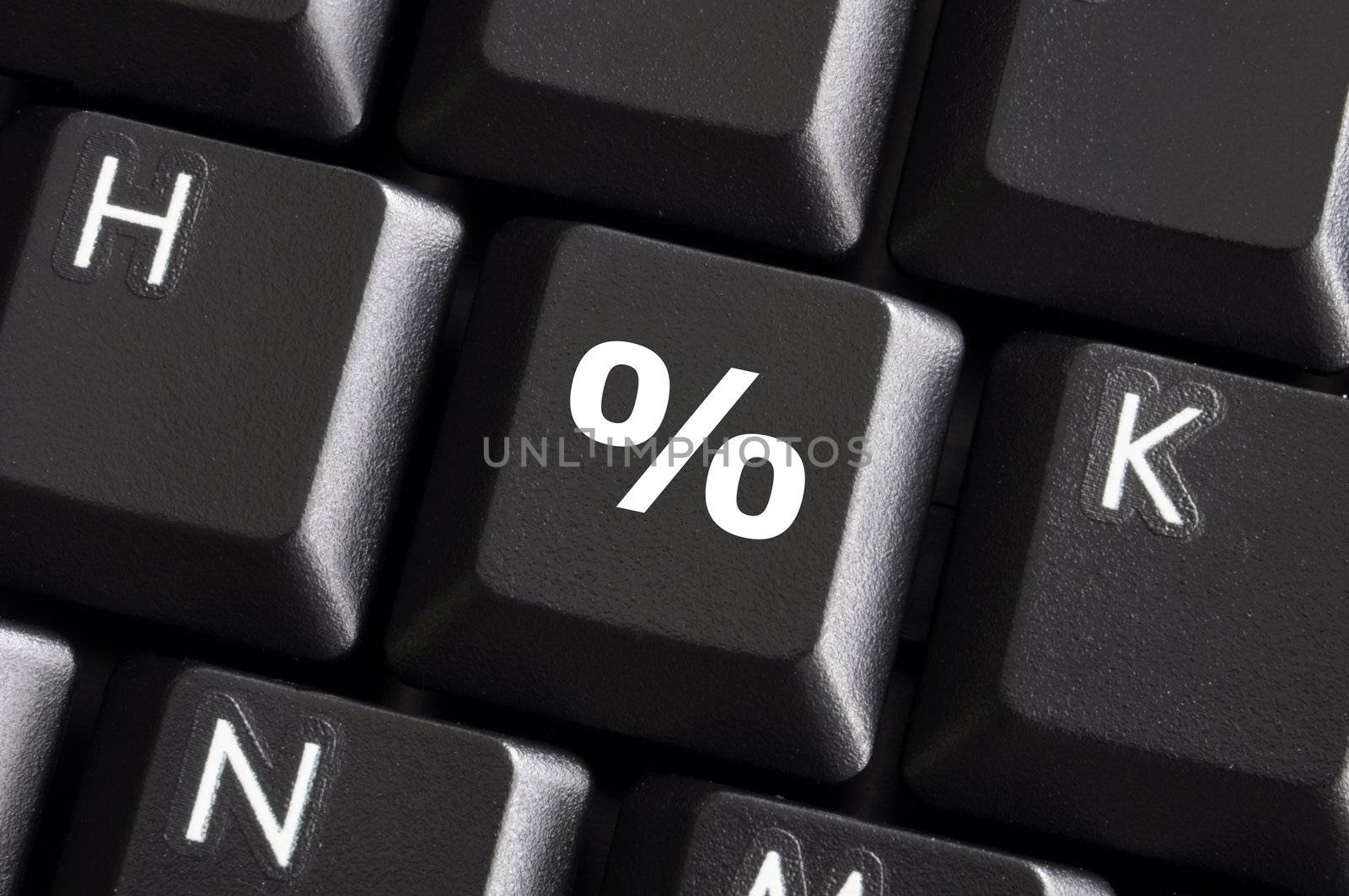 percent sign on computer keyboard showing discount concept