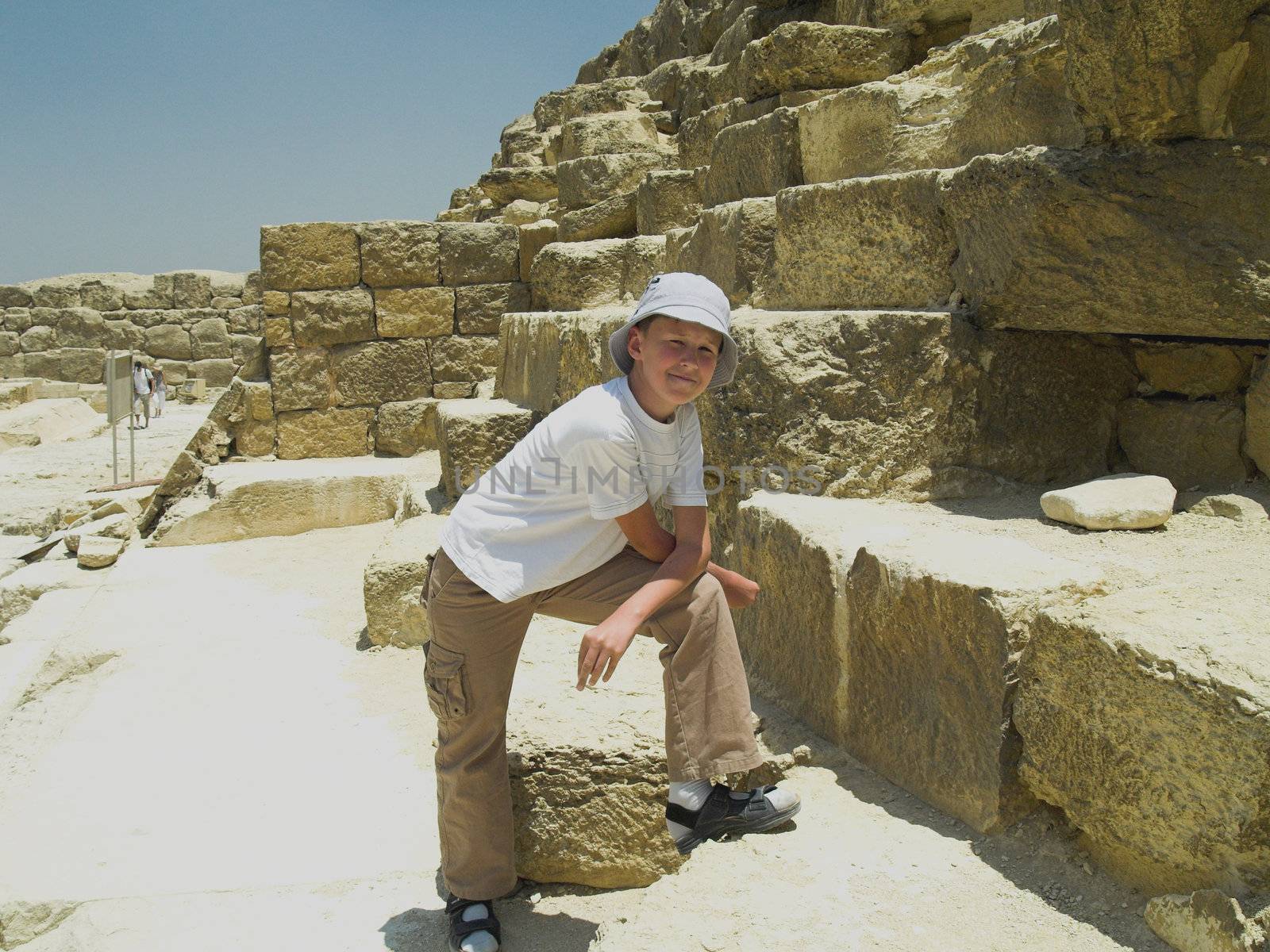 Boy near the Greate Pyramid of Giza. Egypt Cairo