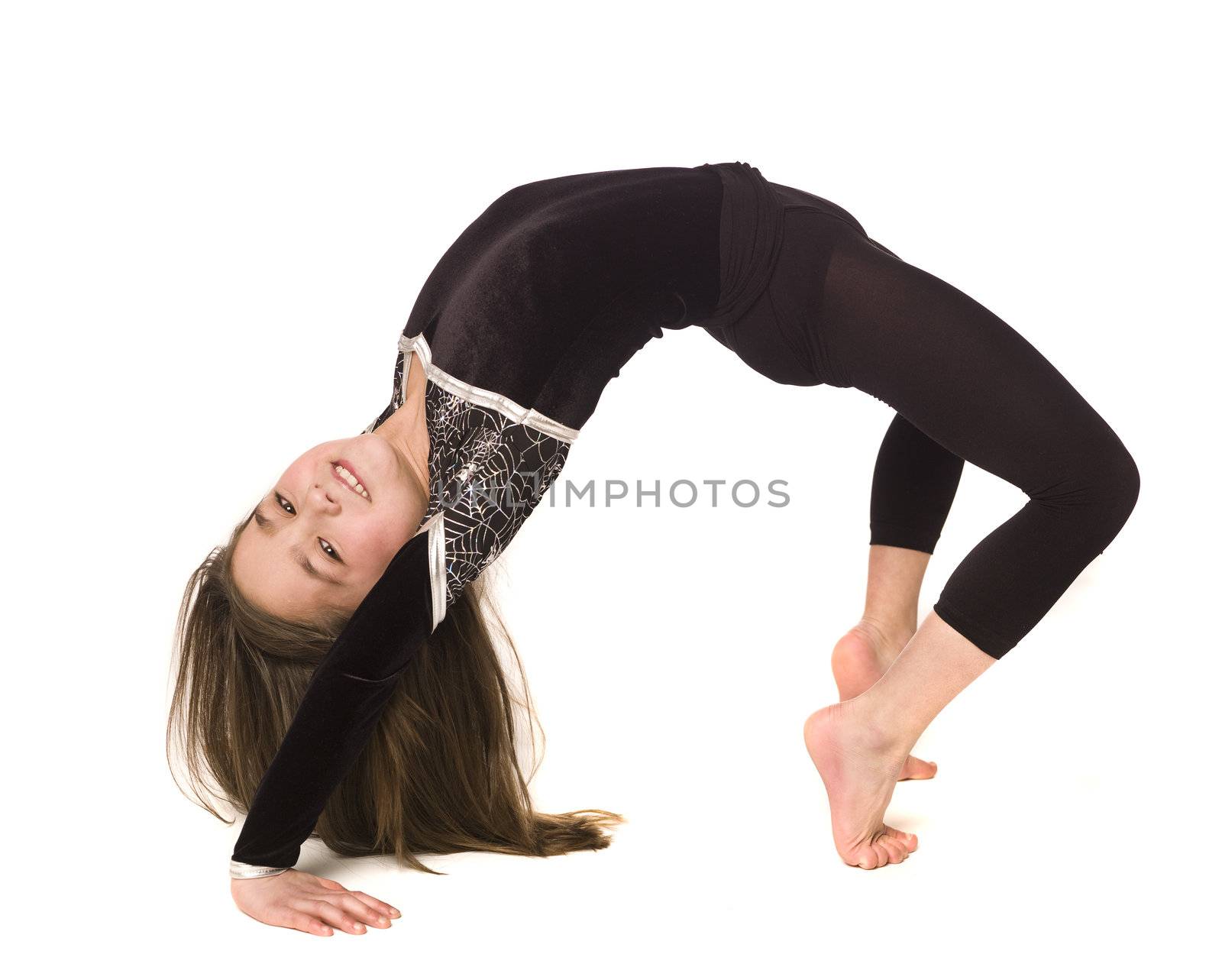 Young girl doing gymnastics isolated on white background