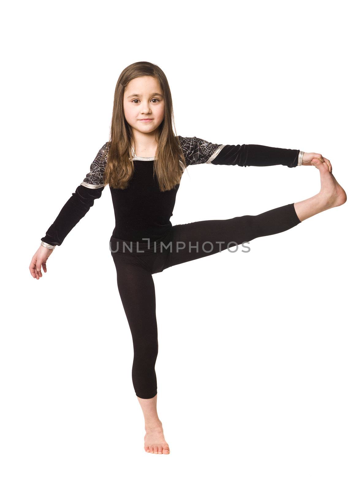 Young girl doing gymnastics by gemenacom