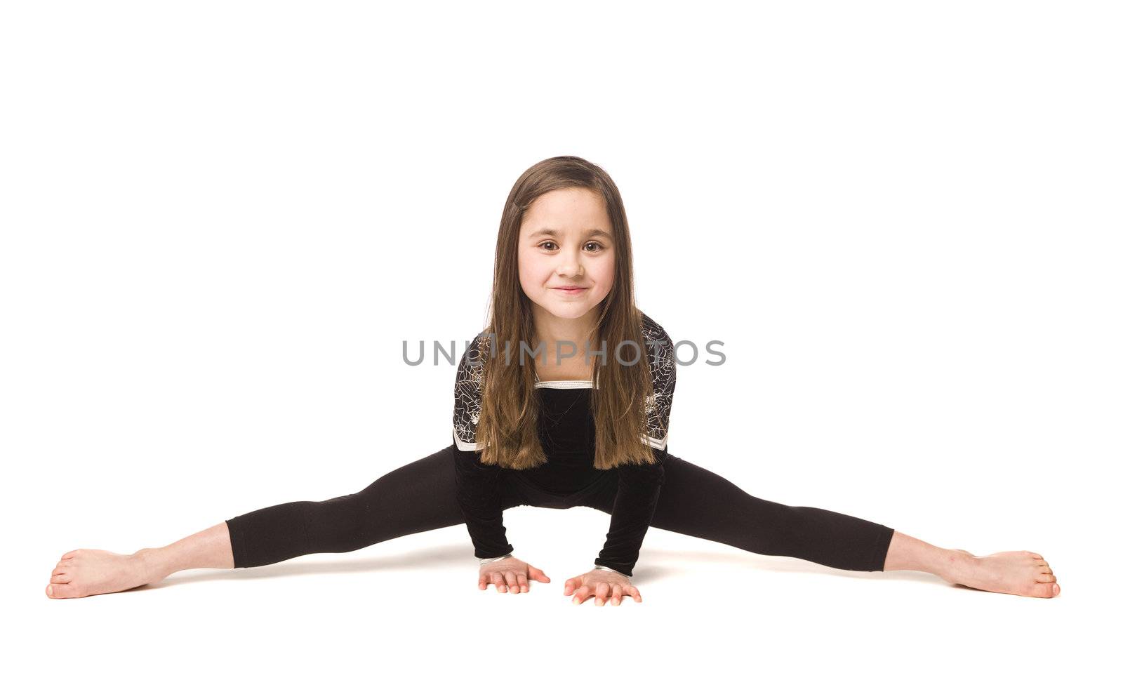 Young girl doing gymnastics isolated on white background