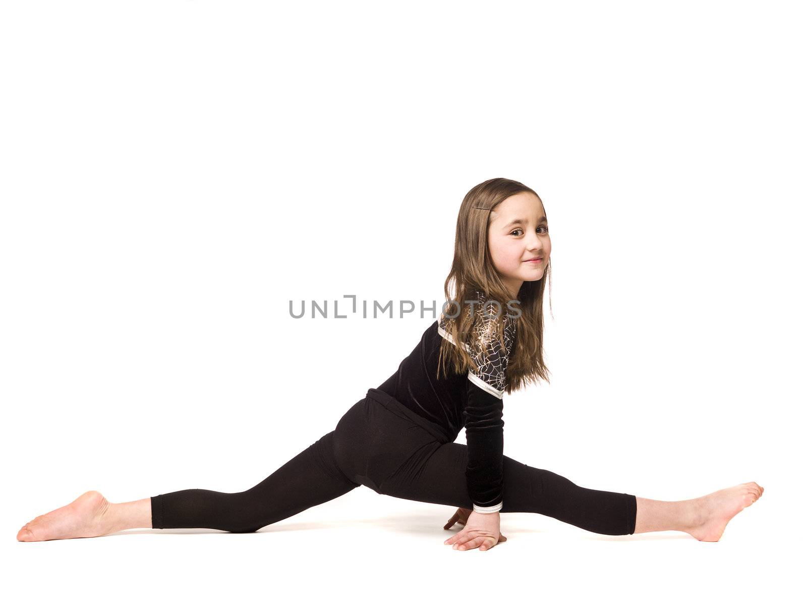 Young girl doing gymnastics isolated on white background