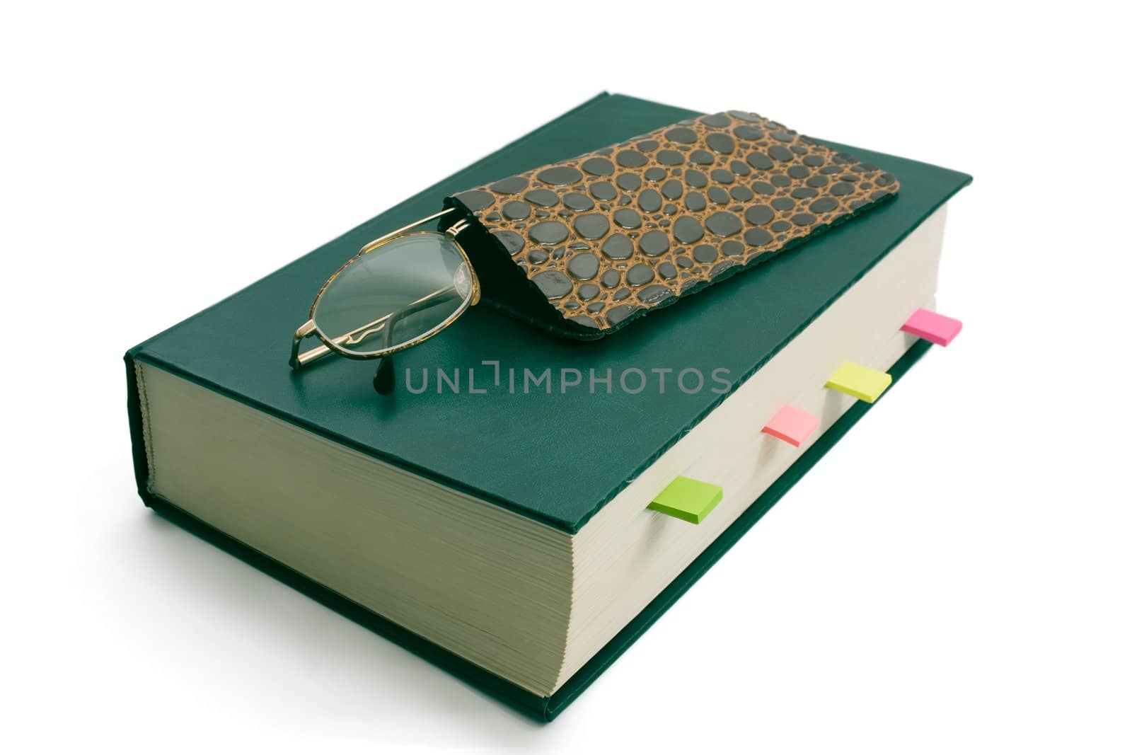 Green book and spectacles,isolated on white background