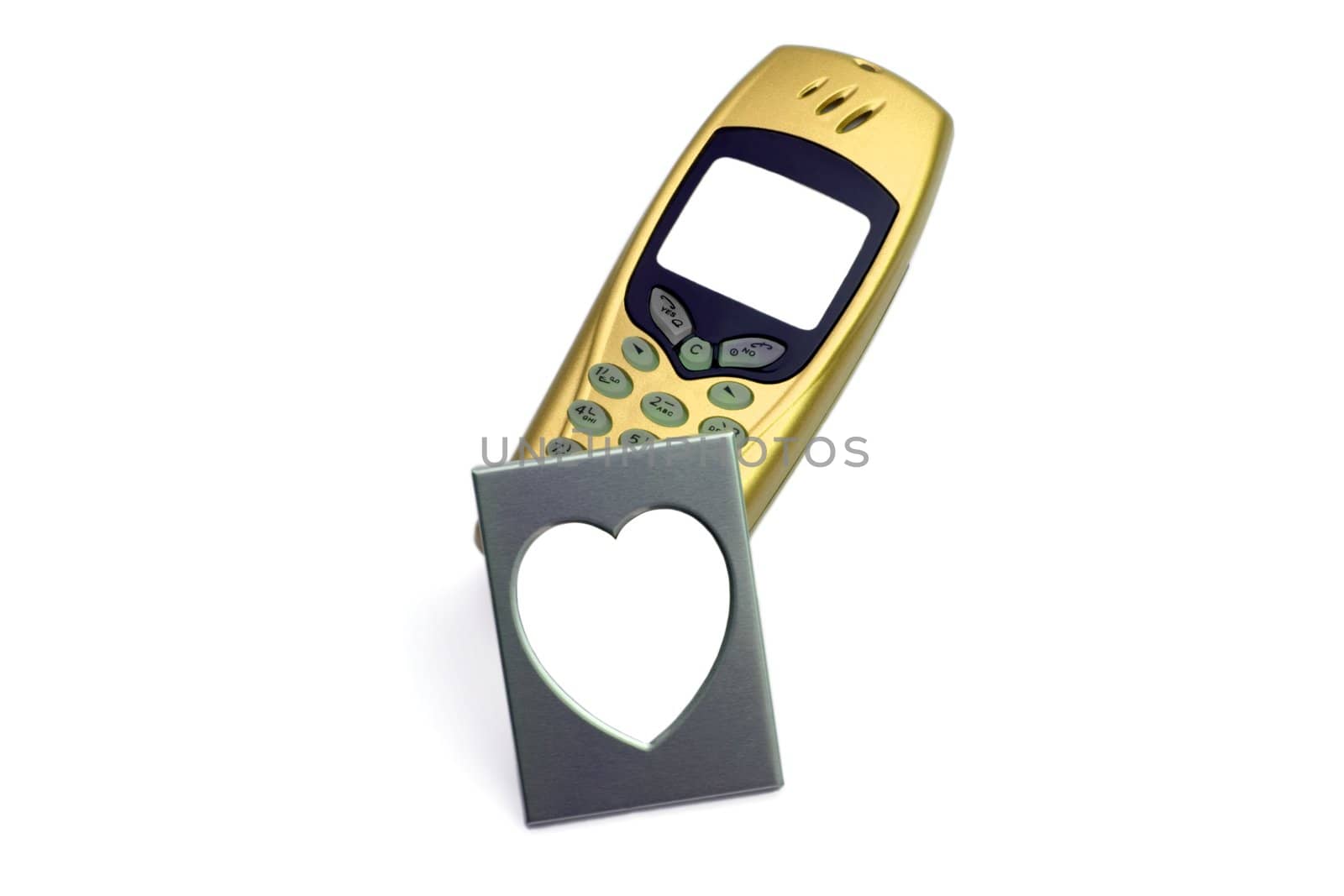 Golden telephone with photo Frame in the manner of heart,isolated in white background.