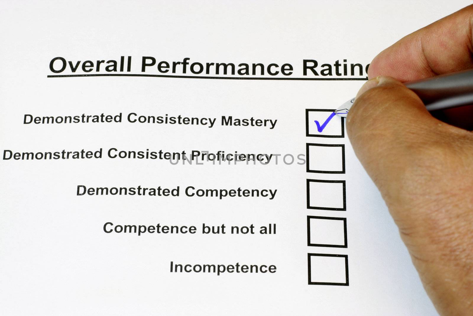 Overall Performance Rating Form with hand and pen