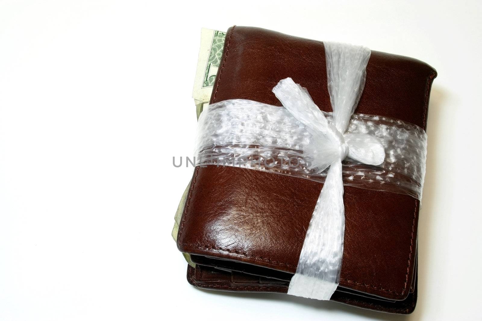 Wallet tie with plastic string - conceptual for financial difficulties and tight Budget with copy space