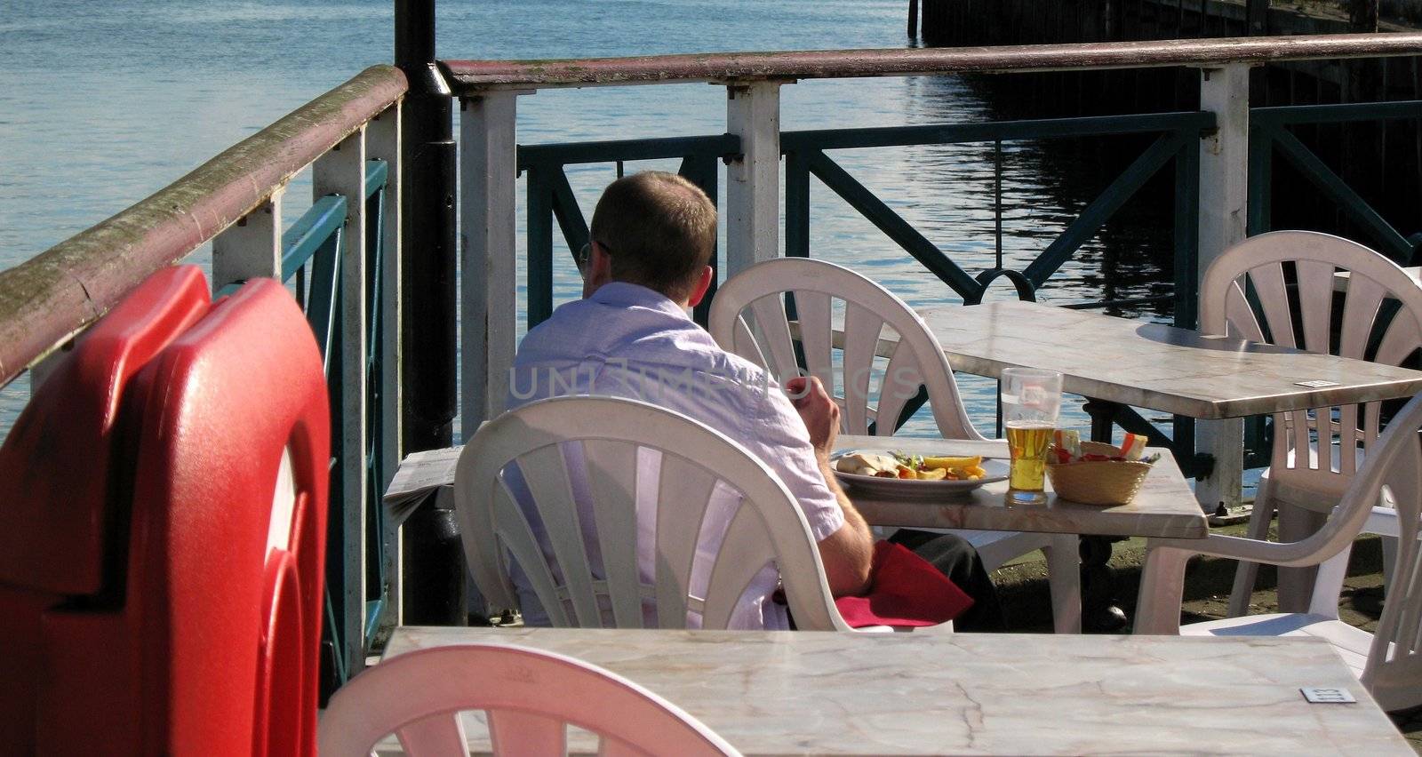 Office worker taking a relaxing lunch by himself. Or may also be used in dating concepts signifying being single.