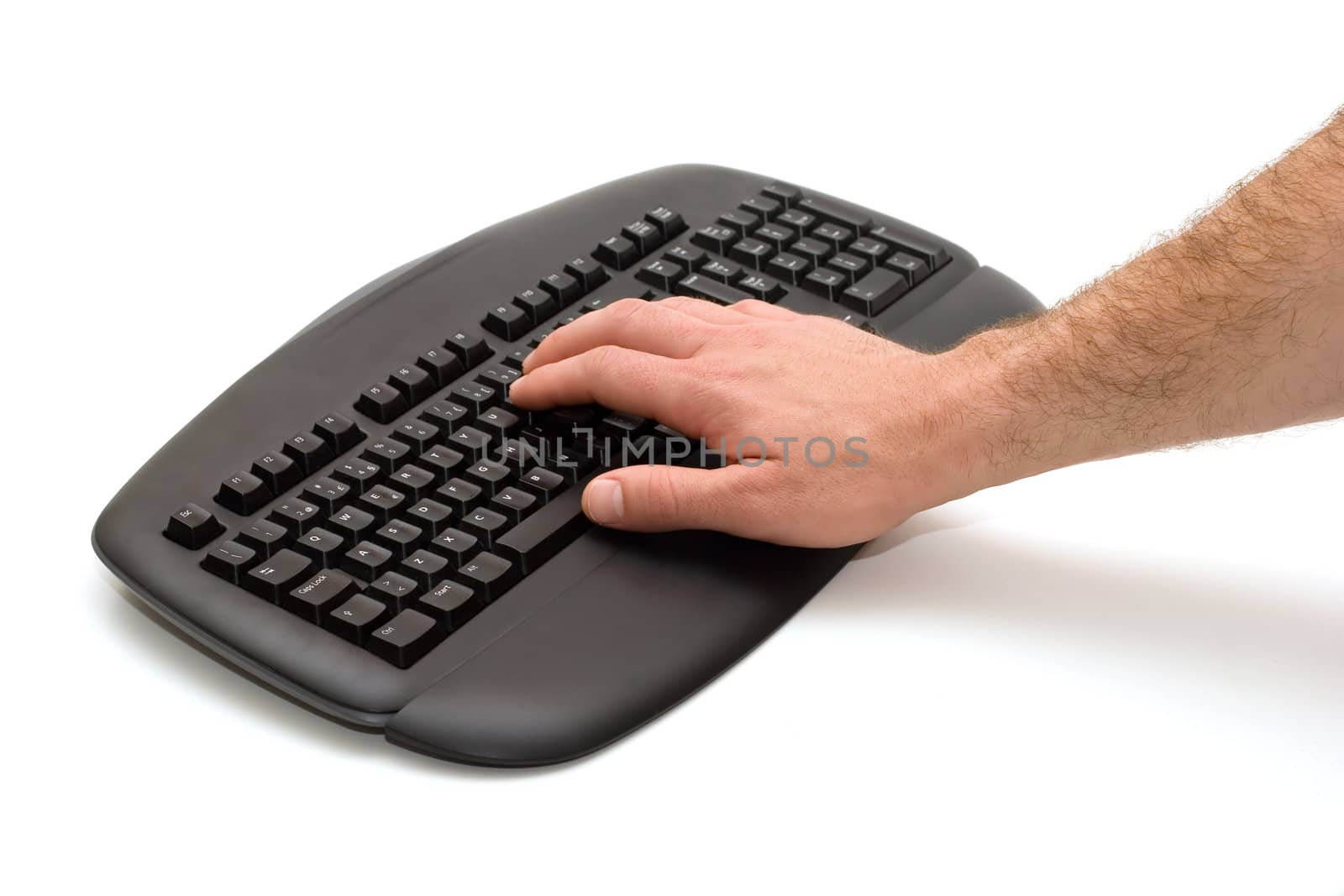 Hand typing on black keyboard on white background