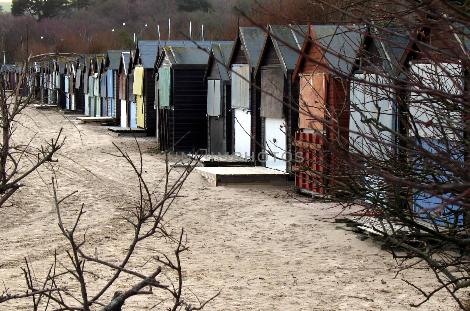 Abandoned beach huts by tommroch