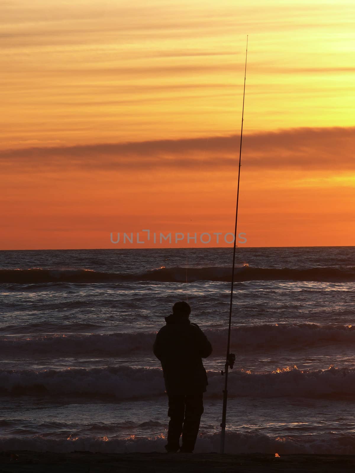 fishermen fishing in the sunset