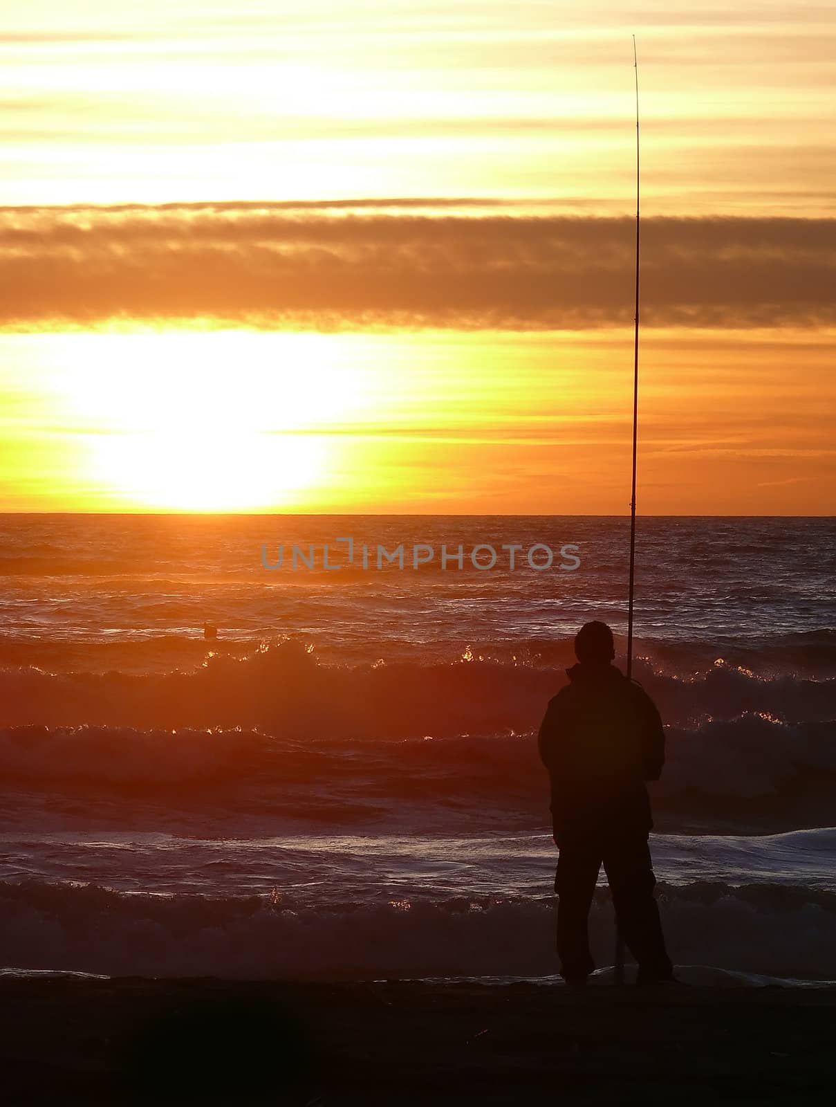 fishermen fishing in the sunset