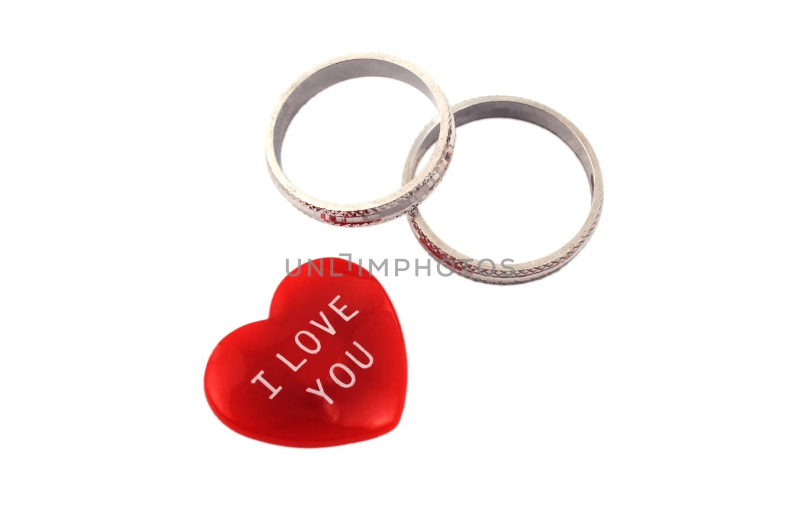 Red heart with I Love You message and two rings isolated on white