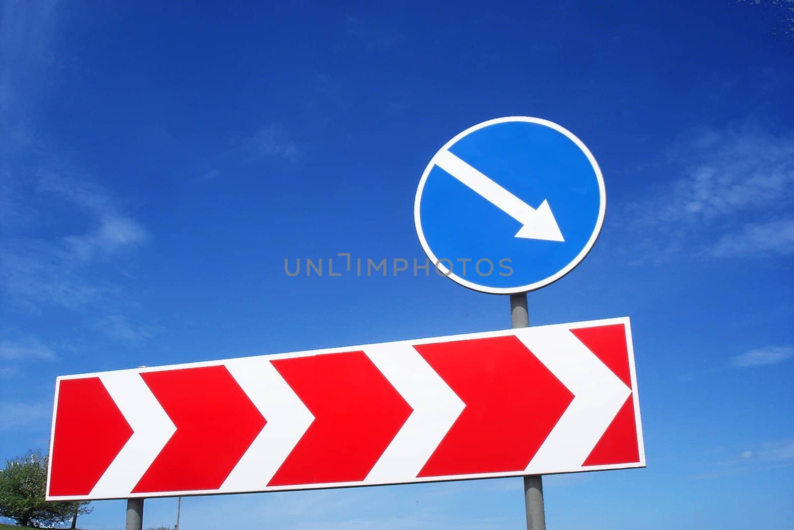 Road sign on a blue sky background