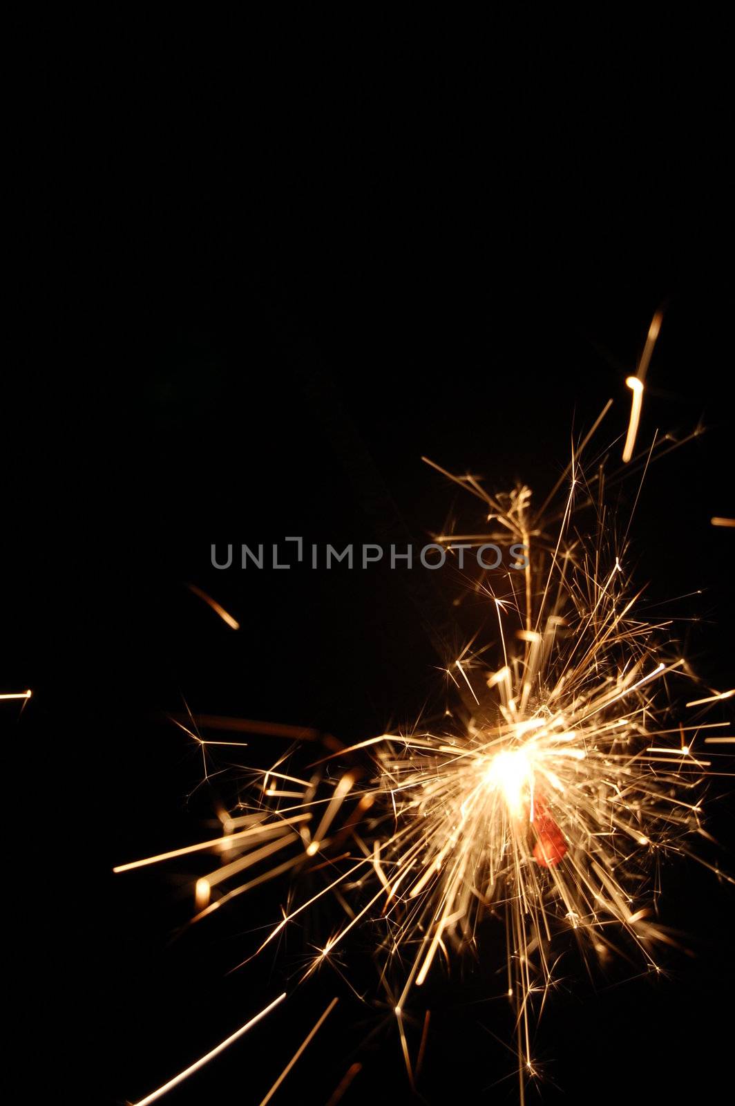 holiday sparkler isolated on black background with copyspace