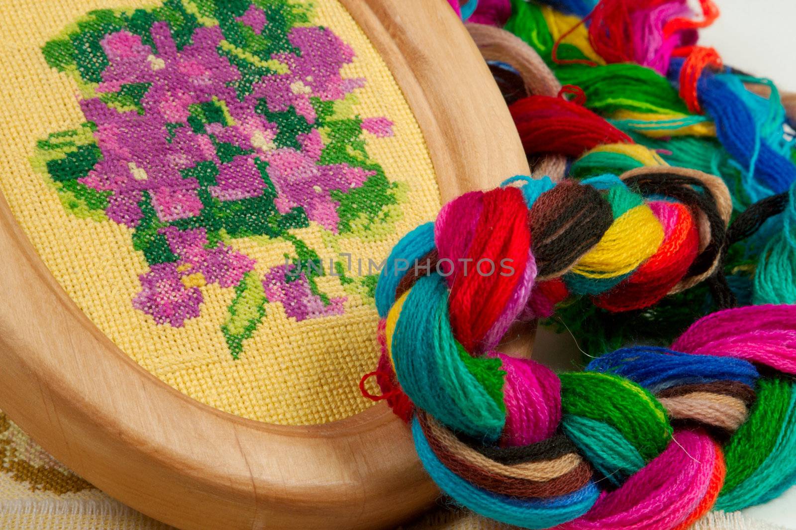 Violet flower embroidered with silk threads