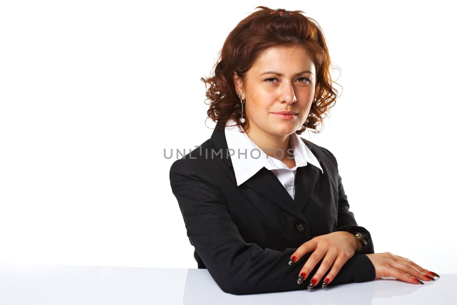 Pretty confident business woman with hands folded, against white background