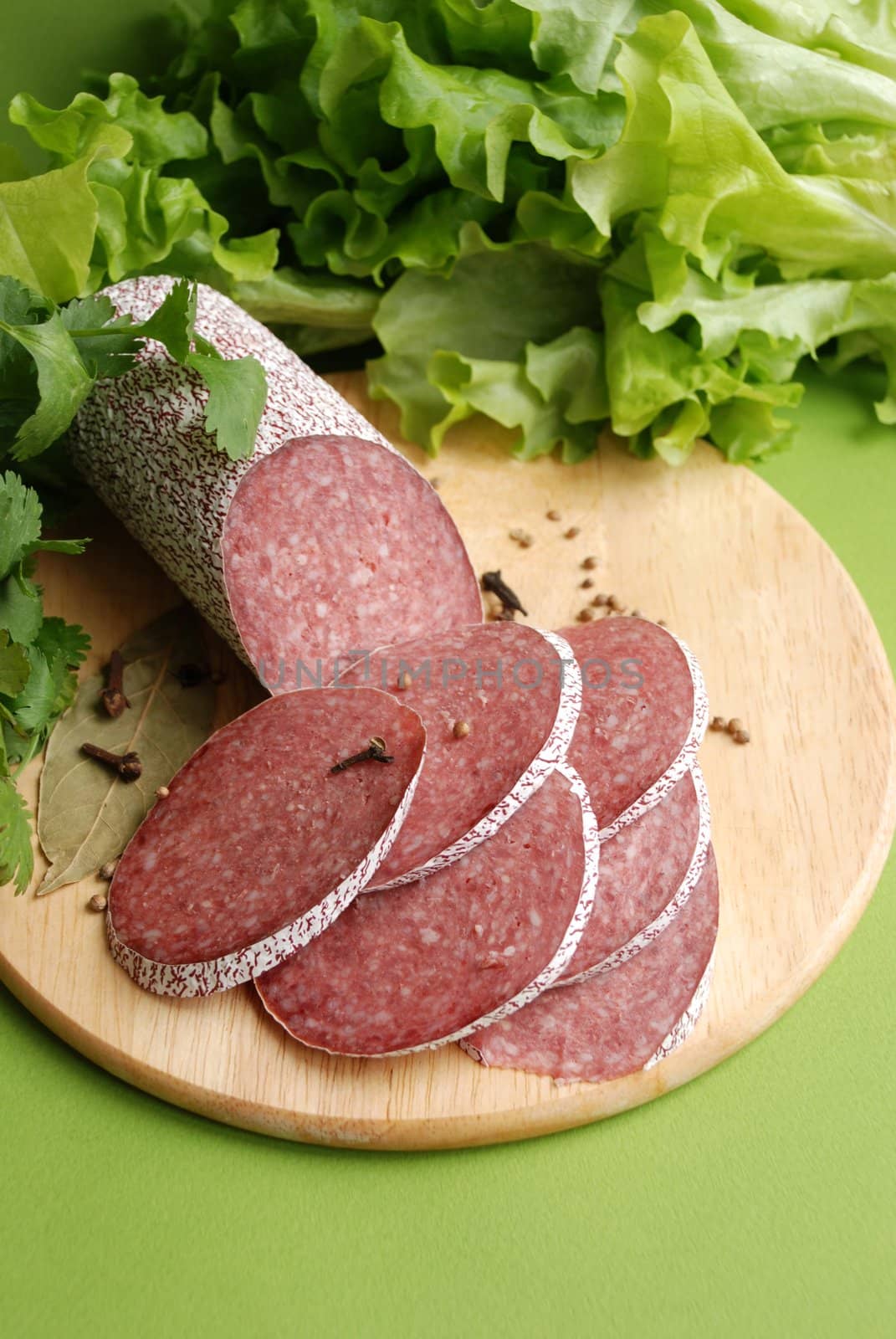 Salami sausage and lettuce close up